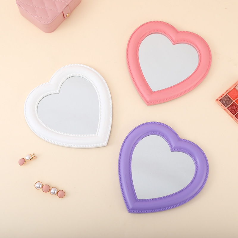 Compact heart-shaped mirror
